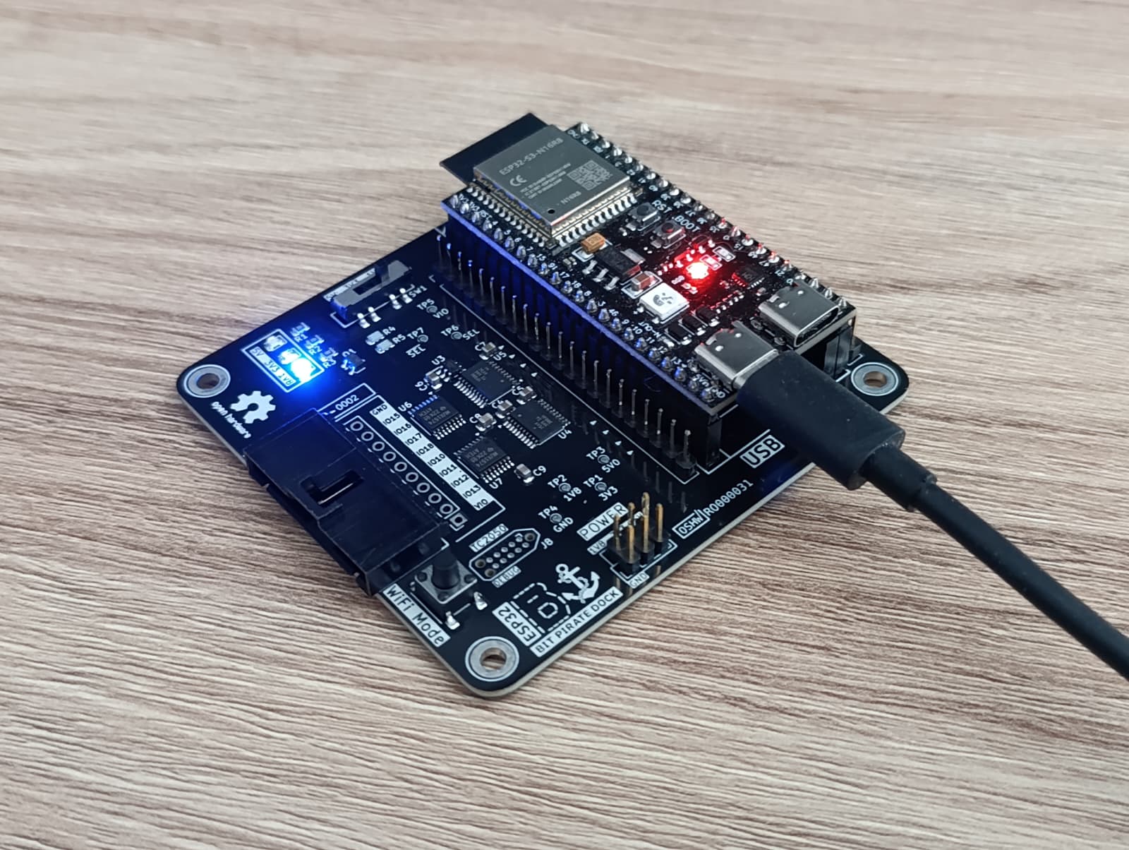 Assembled ESP32 Bit Pirate Dock with an ESP32-S3 DevKit seated and powered on