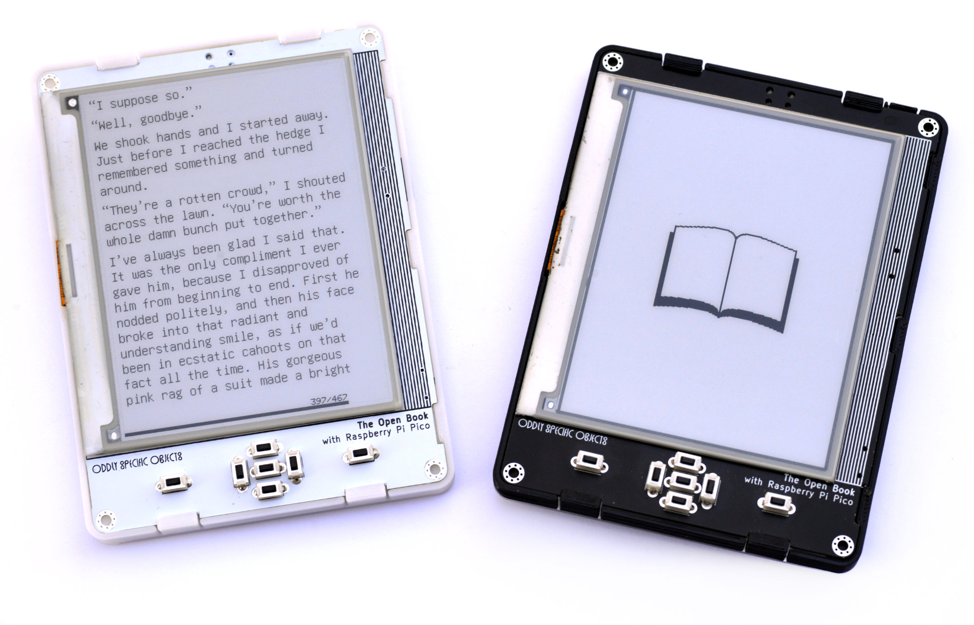 Two assembled Open Book e-readers, white and black cases, showing the e-paper display